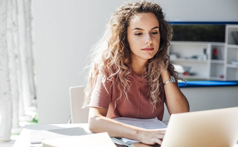 Girl reading on computer