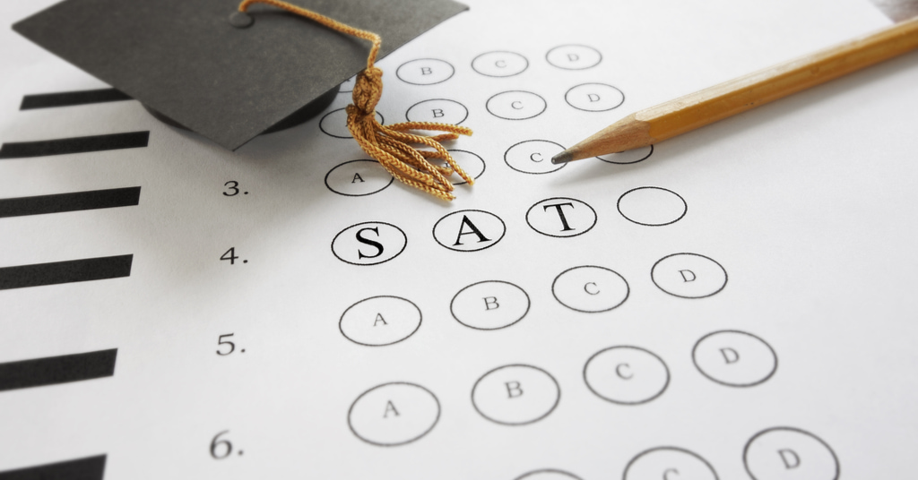 SAT test with pencil and mortar board graduation guard