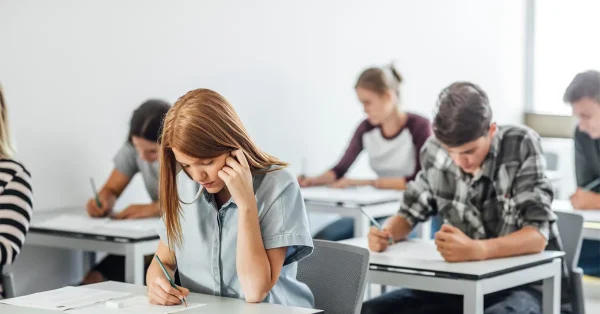 A group of high school students taking the SAT exams