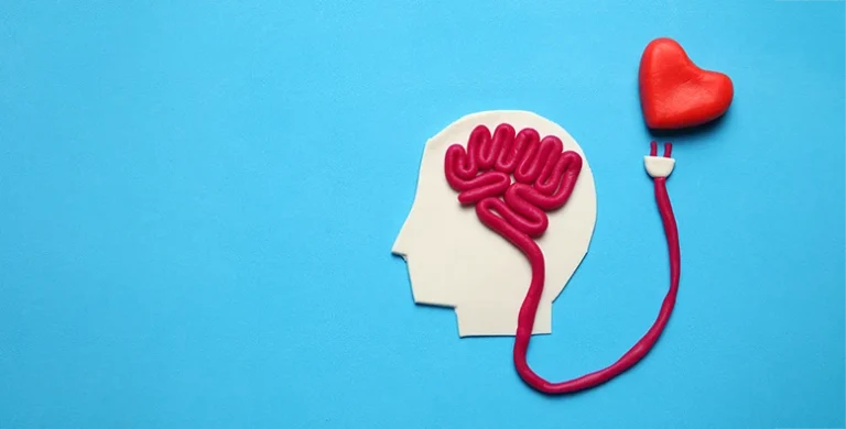 Abstract image of a person’s head with the brain powered by the heart, symbolizing the connection between emotion and cognition—perfect for students exploring key AP Psychology themes over the summer.