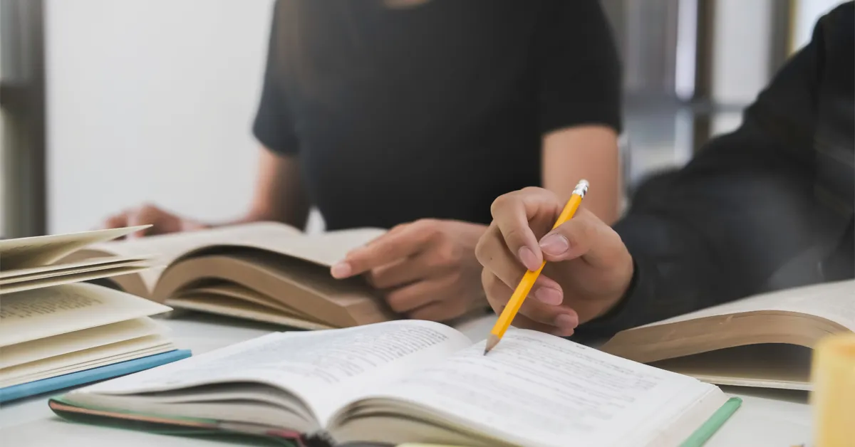 Student reviewing a college majors guidebook