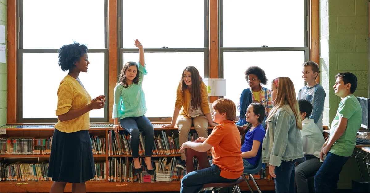 A group of high school students with teacher in a AP class