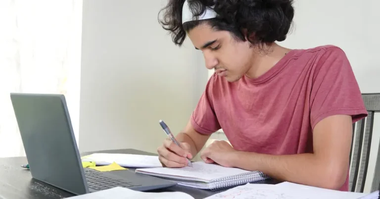 Teenage boy getting homeschooling for SAT prep virtually