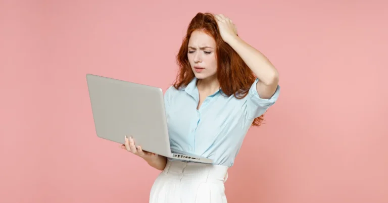 High school student holding a computer and confused about a mistake on a Digital SAT question.